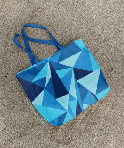 Printable Digital Art Download In Blue Triangle Pattern by ColorfulHabit Presented on a Canvas Tote on the Sand