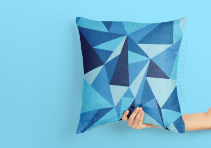 Printable Digital Art Download In Blue Triangle Pattern by ColorfulHabit Presented on a Pillow Held by a Hand