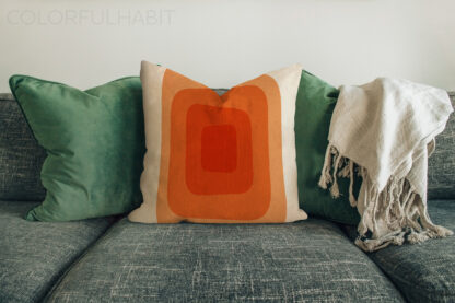 Abstract Orange Minimal Printable Digital Art Download by ColorfulHabit Presented on a Pillow on a Couch