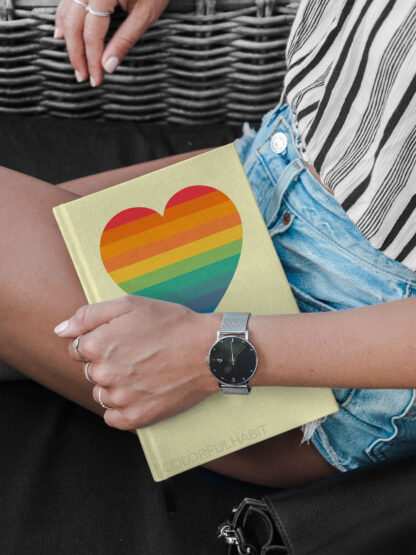 Vintage Rainbow Heart Printable Digital Art Download by ColorfulHabit Presented on a Hardcover Book Held by a Woman