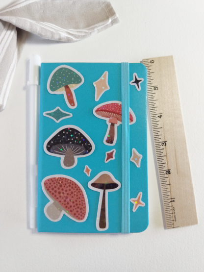 Mushroom Holographic Stickers on Notebook by ColorfulHabit