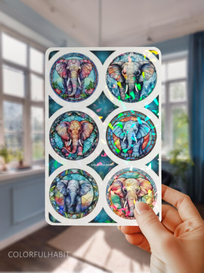 Hand Holding Elephants Holographic Sticker by ColorfulHabit 1