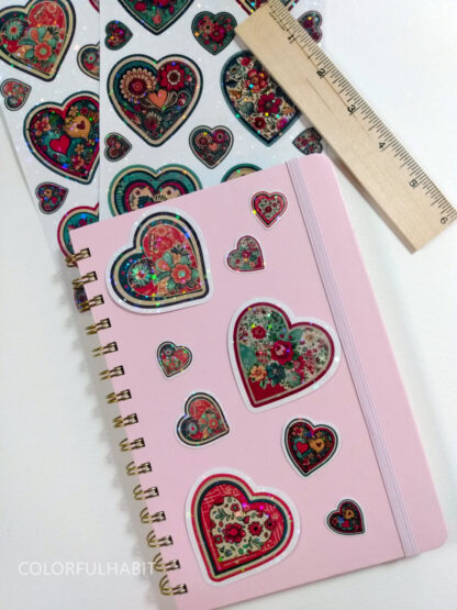 Hearts Holographic Stickers on Notebook by ColorfulHabit